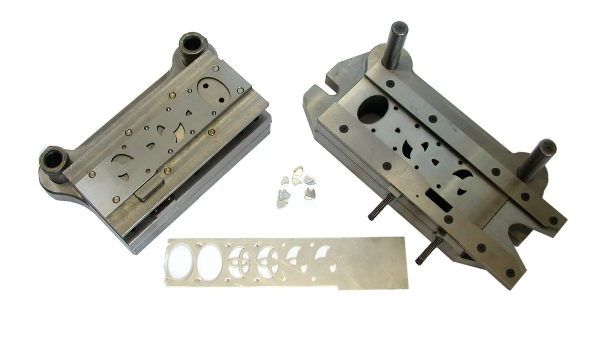 Progressive die with scrap strip and stampings