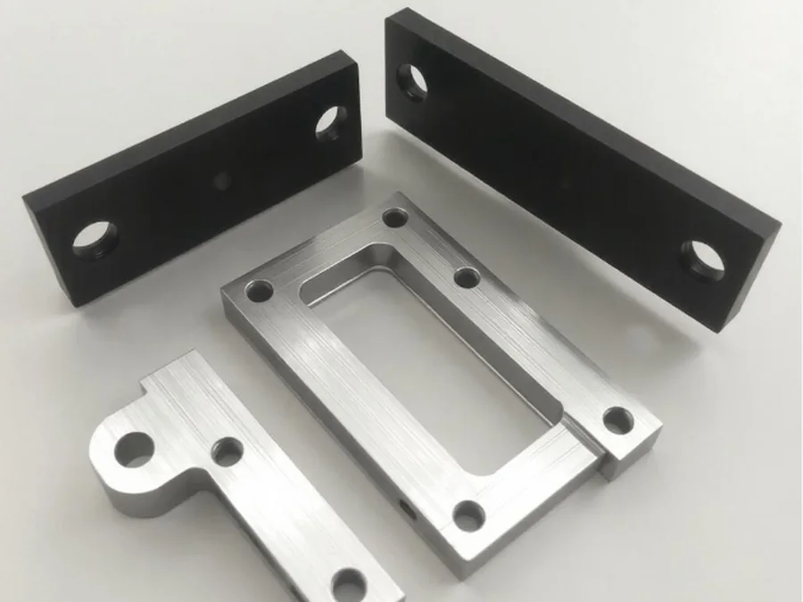 Aluminum and steel CNC machined parts used as examples for impact strength design review